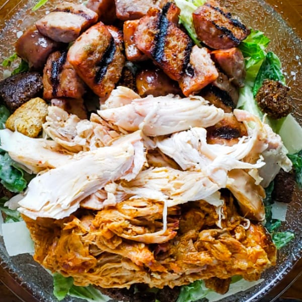 KC's Rib Shack BBQ salad with grilled sausage, pulled chicken, and shredded pork.